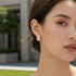 Asian model wearing pink earrings outdoors