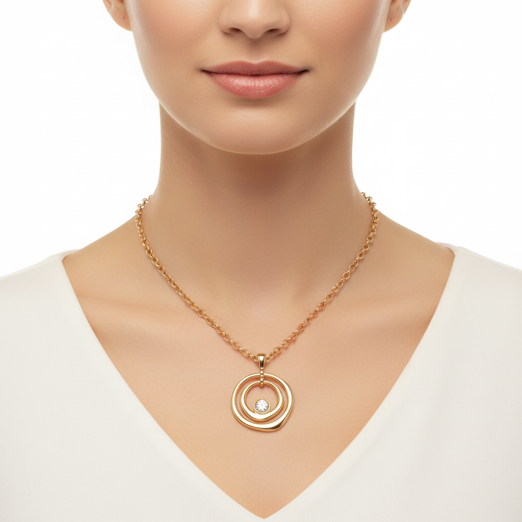 Gold circle necklace on model