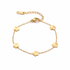 Gold clover charm bracelet on white background