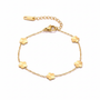 Gold clover charm bracelet on white background