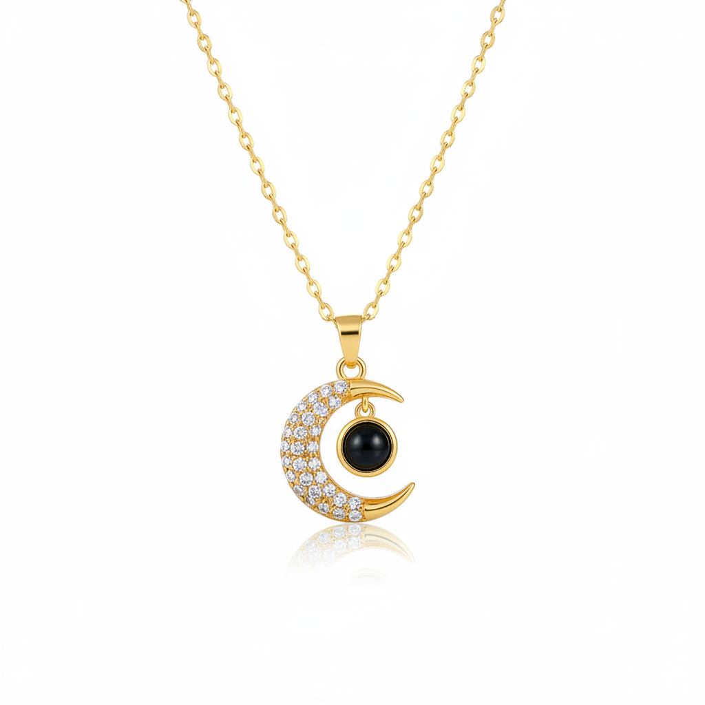 Gold crystal moon pendant necklace on white background