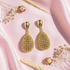 Gold droplet earrings flat lay
