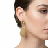 Gold droplet earrings on model