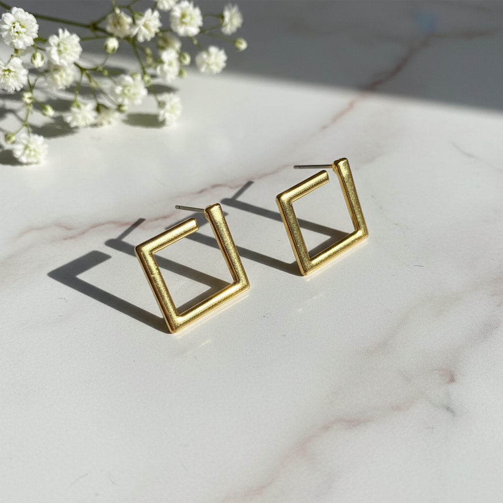Gold geometric square studs on marble