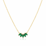 Gold green crystal leaf necklace on white background