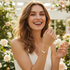 Gold heart crystal bracelet on model with face showing