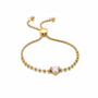 Gold heart crystal bracelet on white background