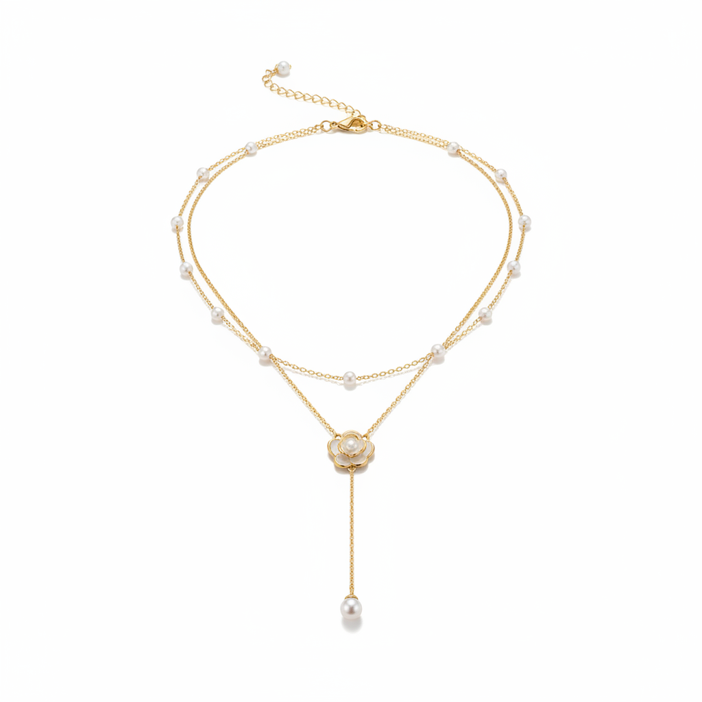 Gold layered pearl necklace on white background