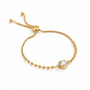 Gold round crystal bracelet on white background