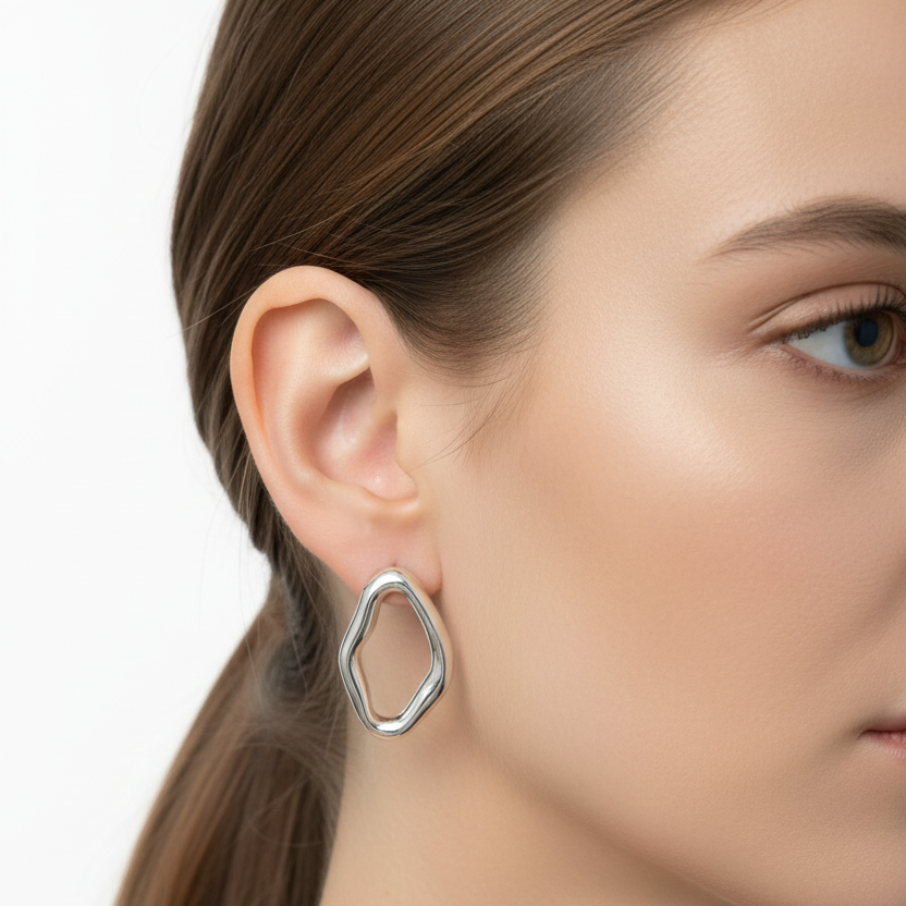 Organic silver hoop earrings on model