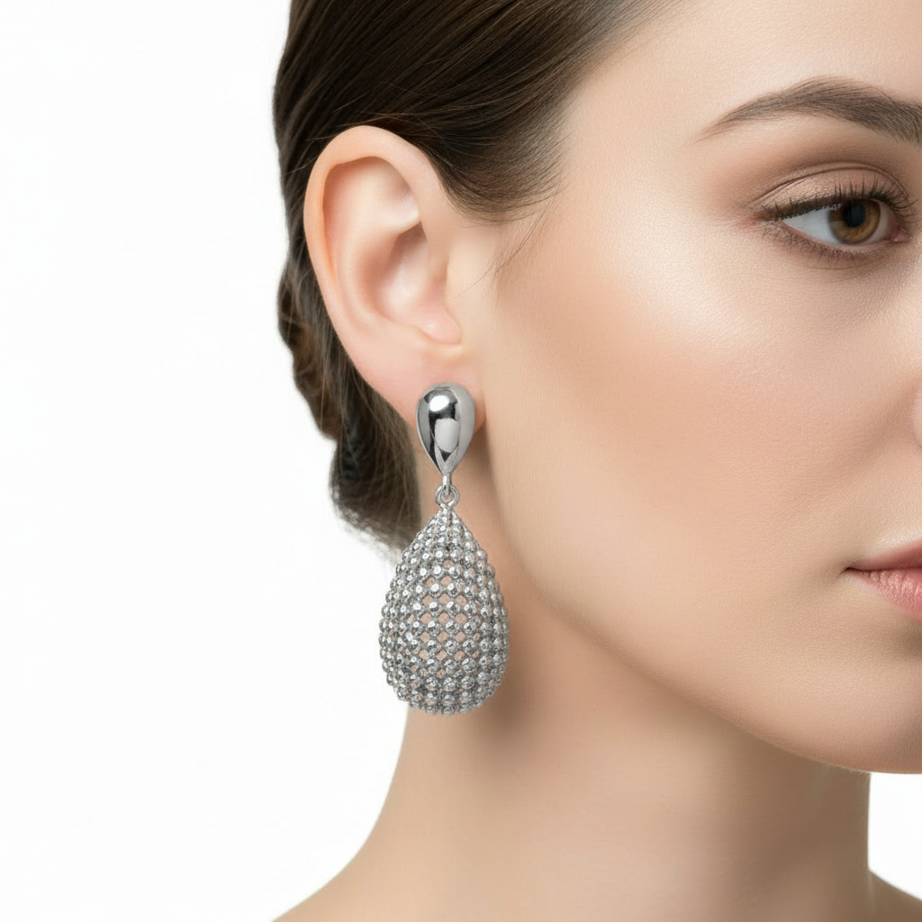 Silver droplet earrings on model