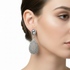 Silver droplet earrings on model