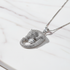 Silver leopard necklace on marble