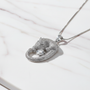 Silver leopard necklace on marble