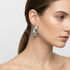 Silver teardrop earrings on model