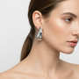 Silver teardrop earrings on model