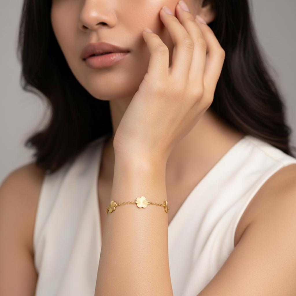 Square format model wearing gold flower bracelet