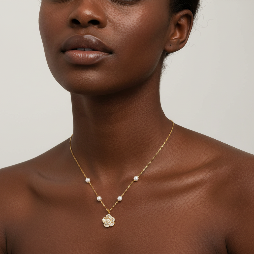 Square format model wearing rose necklace with smaller pendant and pearls