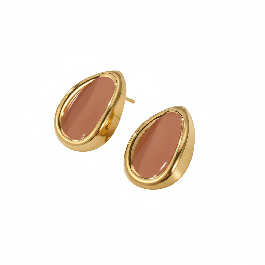 Three-quarter angle of brown earrings on white background