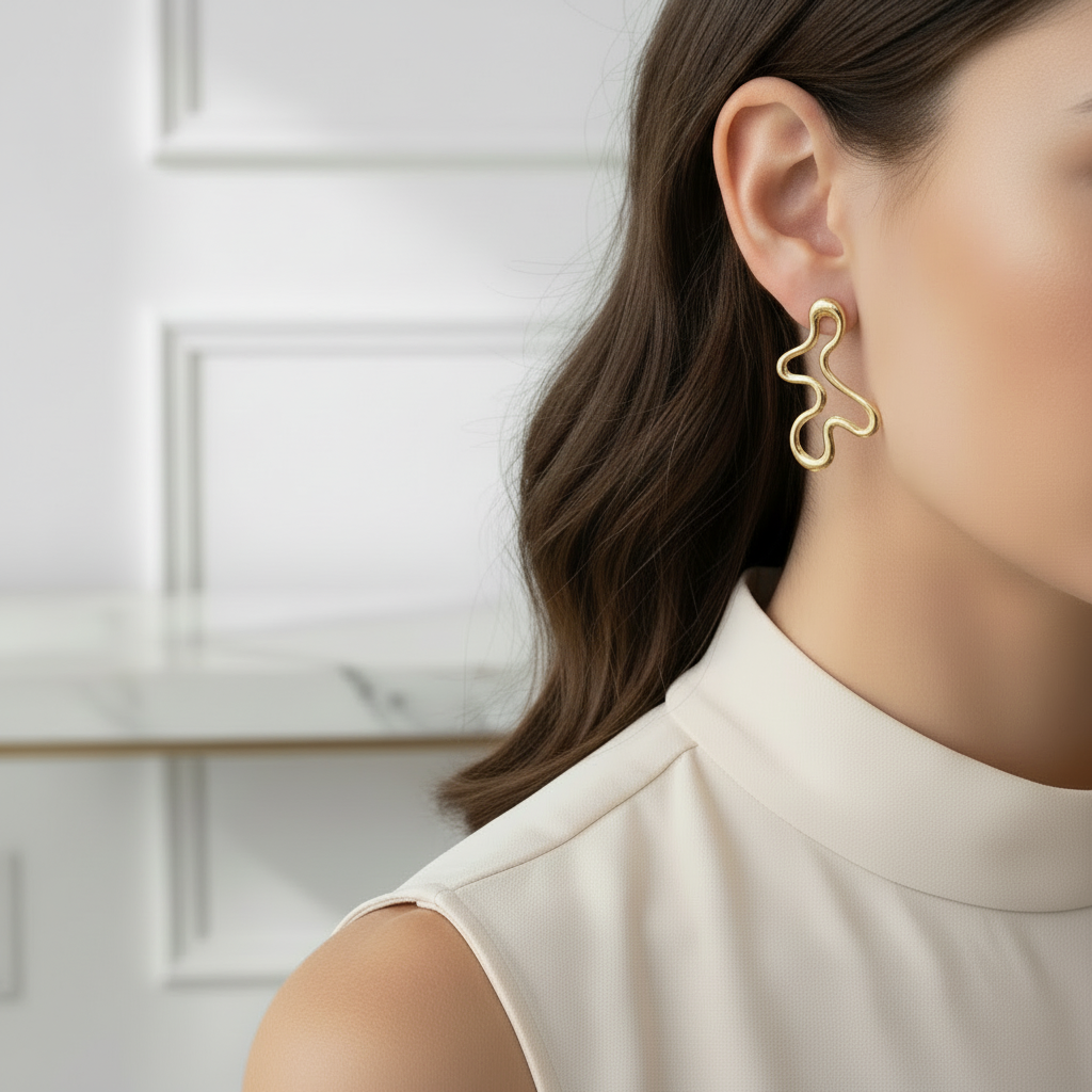 Wavy gold earrings on model - smaller size